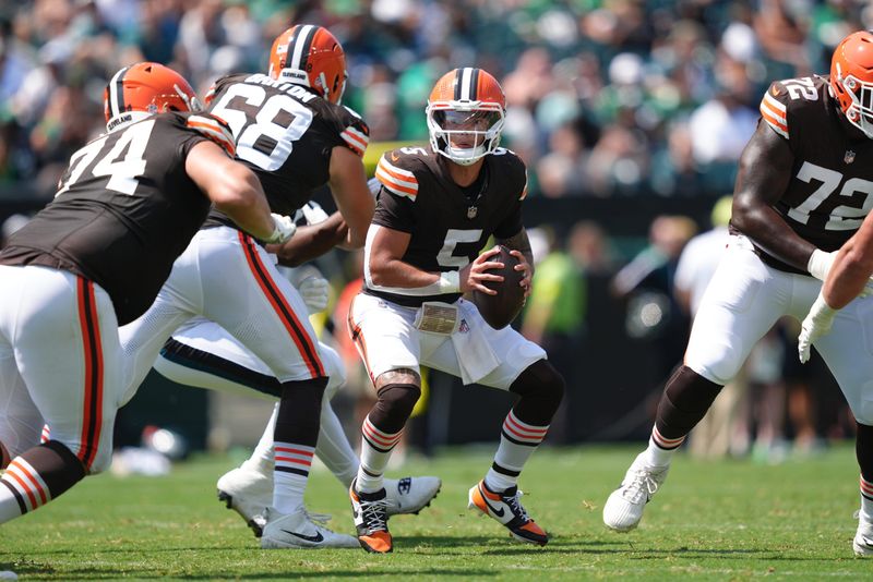 Aug 16, 2025; Philadelphia, Pennsylvania, USA; Cleveland Browns quarterback Dillon Gabriel (5) scrambles from the pocket against the Philadelphia Eagles in the first half at Lincoln Financial Field. Mandatory Credit: Kyle Ross-Imagn Images