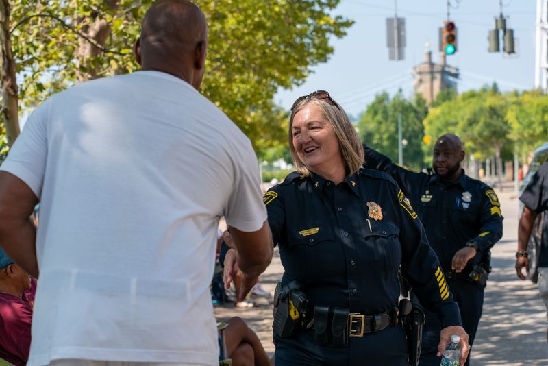 Cincinnati Police Chief Theetge greets members of the crowd during the parade for the 37th Annual Midwest Regional Black Family Reunion on Aug. 16.