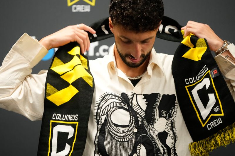Crew forward Wessam Abou Ali prepares to speak to the media on Aug. 19.