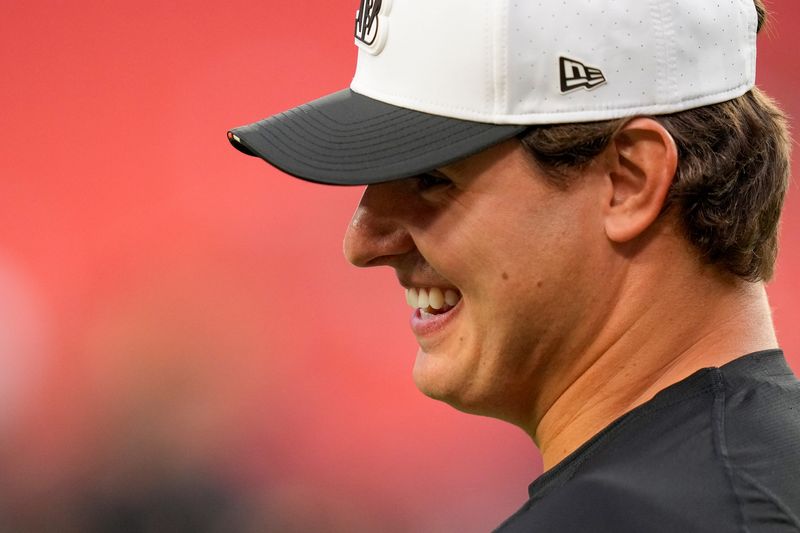 Cincinnati Bengals defensive end Trey Hendrickson (91) talks with director of player personnel Duke Tobin before the first quarter of the NFL Preseason Week 2 game between the Washington Commanders and the Cincinnati Bengals at Northwest Stadium in Landover, Md., on Monday, Aug. 18, 2025.