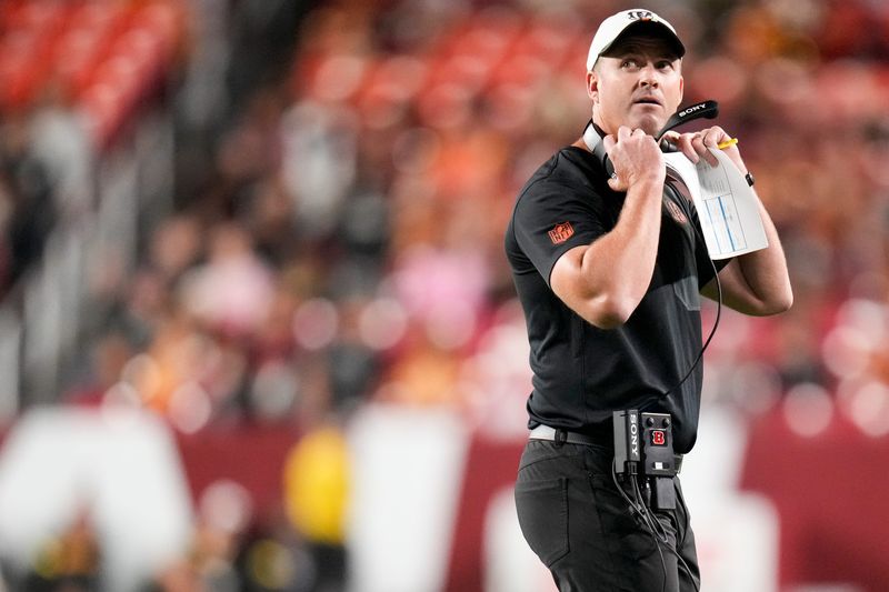 Cincinnati Bengals head coach Zac Taylor watches a replay on the video board in the first quarter of the NFL Preseason Week 2 game between the Washington Commanders and the Cincinnati Bengals at Northwest Stadium in Landover, Md., on Monday, Aug. 18, 2025.