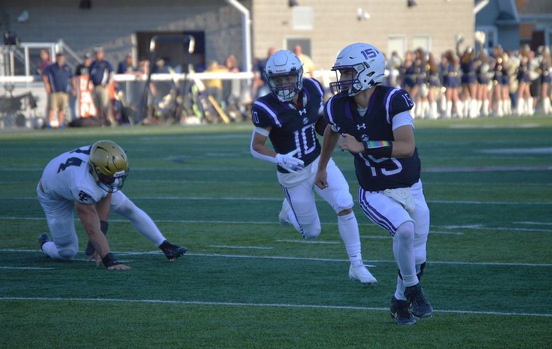 Ross quarterback Breylen Garza looks to block for Stephen Reiter.
