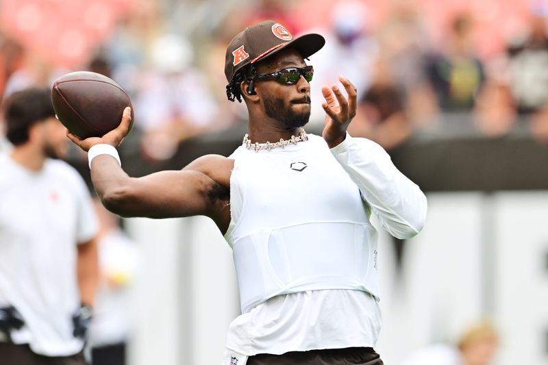Aug 23, 2025; Cleveland, Ohio, USA; Cleveland Browns quarterback Shedeur Sanders (12) warms up before the game between the Browns and the Rams at Huntington Bank Field. Mandatory Credit: Ken Blaze-Imagn Images