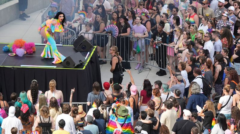 Thousands crowd into Lock 3 Park to watch drag queens perform during the 2025 Akron Pride Festival, Aug. 23, 2025, in Akron, Ohio.