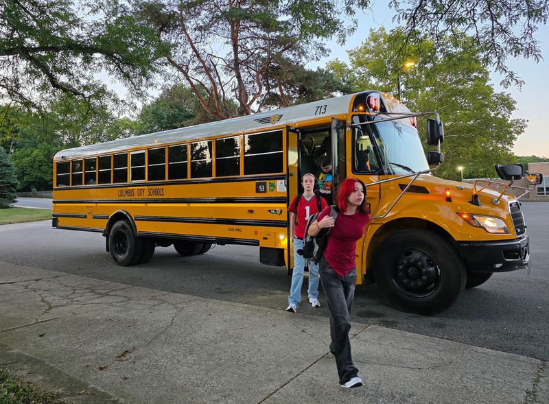 Students get off the bus at Whetstone High School for Columbus City Schools' first day of classes on Aug. 25, 2025.