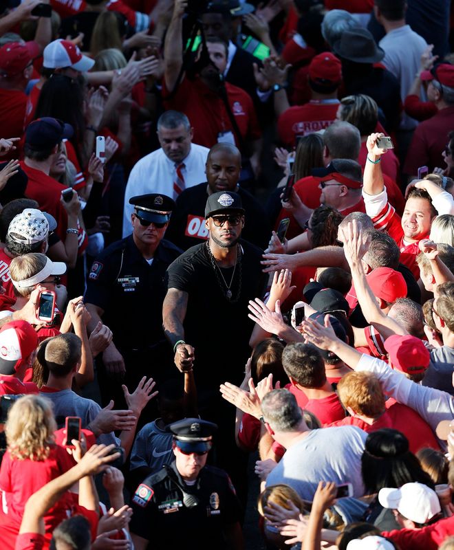 LeBron James follows the OSU football team into the stadium prior to the game between Ohio State and Wisconsin at Ohio Stadium on Saturday, September 28, 2013.