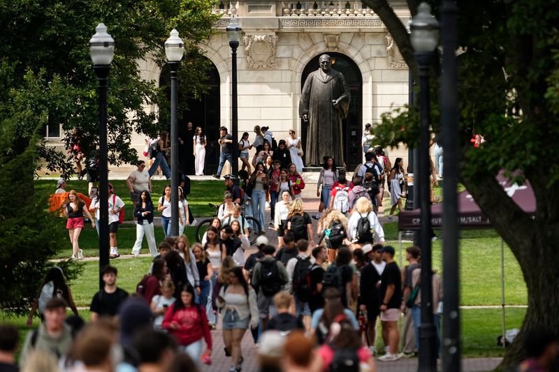 Students walk across the Oval on Ohio State's campus on Aug. 26, 2025, the first day of class for the fall semester.