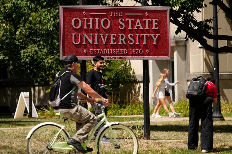 Students walk and ride across Ohio State's campus on Aug. 26, 2025.