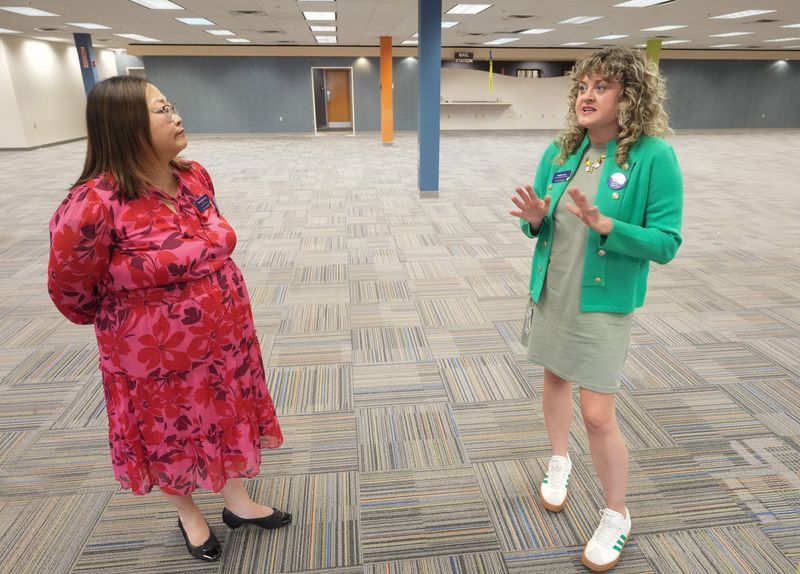Danielle Attar, director of marketing and communications at Stark Library, right, talks about the temporary library that will be housed in the former Nationwide building as Mary Ellen Icaza, the CEO and executive director of Stark Library, listens.