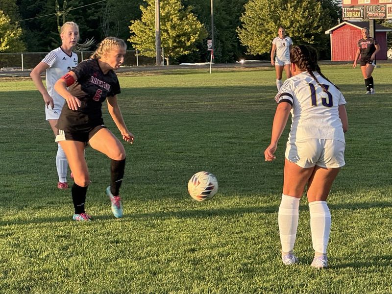 Fairfield Union's Kyla Gasser moves the ball against Bloom-Carroll's Lilly Friestat during the Bulldogs' 4-1 Mid-State League-Buckeye Division win Aug. 27, 2025.