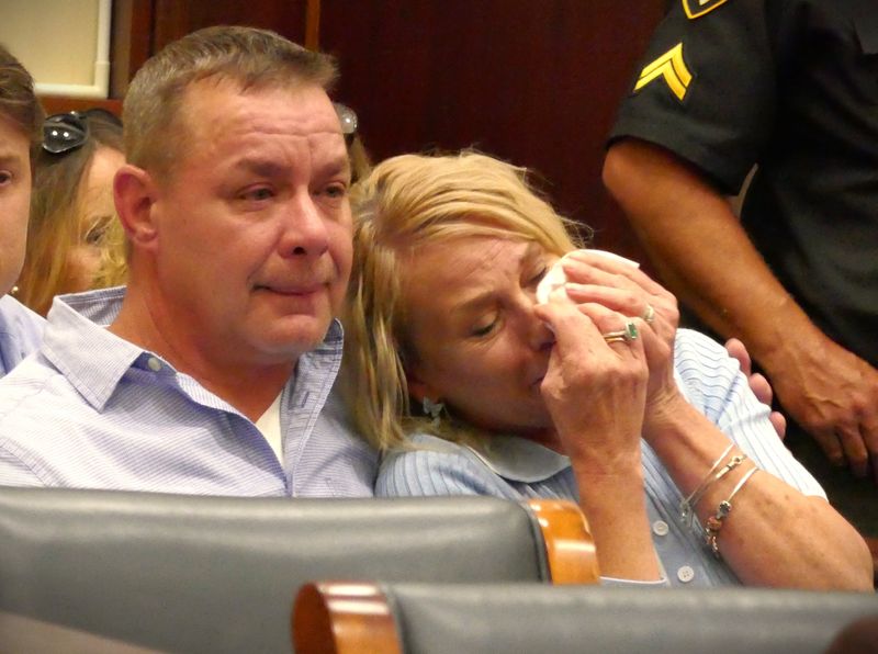 Nicole Coffin, Luke Macke's mother, cries with her husband Eric Coffin as her son's killer is sentenced to 44 years to life in prison. Christian Henderson, 23, was convicted of fatally shooting Macke in 2021 in Westwood.