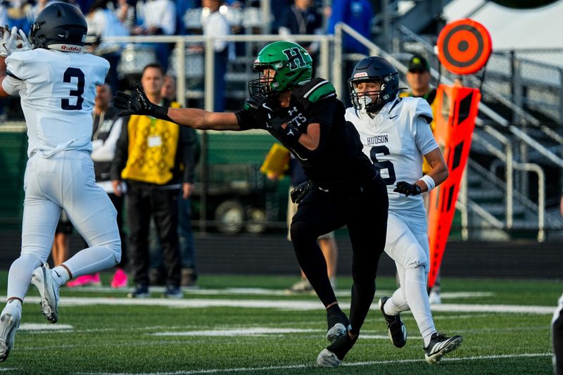 Hudson's Anthony Paolucci (3) intercepts a pass against Highland on Aug. 29, 2025, in Granger Township, Ohio.