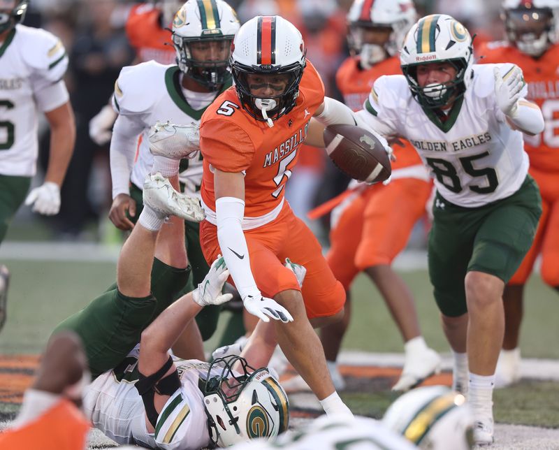Massillon’s Braylon Gamble runs for a gain in the first half against GlenOak at Massillon Friday, August 29, 2025.