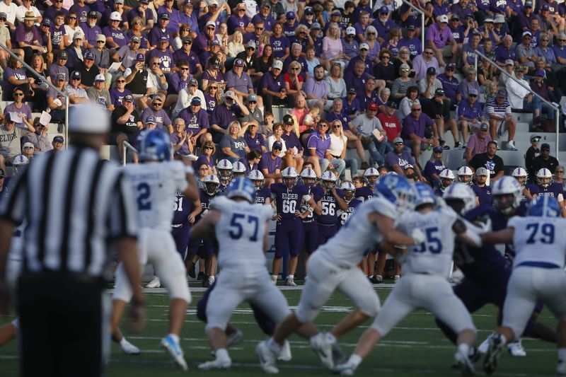 Elder and CovCath run a play as Elder defeated Covington Catholic 28-20 in high school football Aug. 29, 2025 at Elder High School's stadium, The Pit