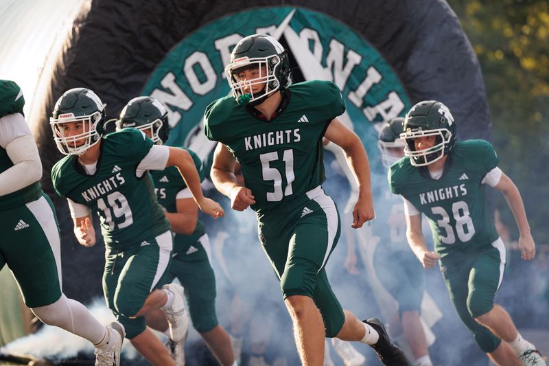 Nordonia Knights players take the field before Friday night’s game against the visiting Akron East Dragons in Macedonia, OH.