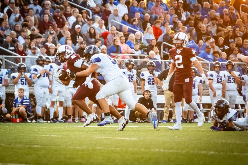 John Glenn RB Reese Metzger evades a Cambridge tackler during a game in New Concord on Friday, August 30, 2025