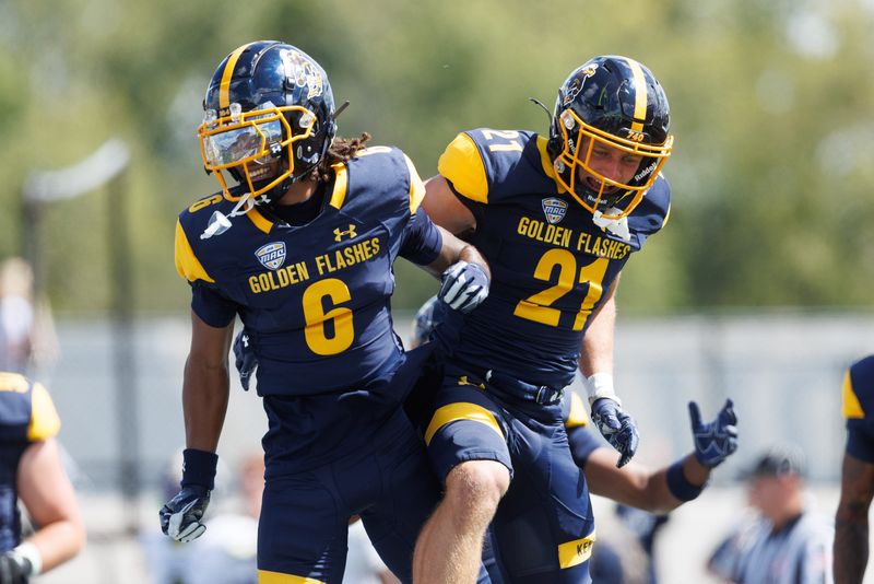 Kent State wide receiver Wayne Harris (6) and running back Cade Wolford (21) celebrate after Wolford’s touchdown against Merrimack College on Aug. 30, 2025, in Kent.