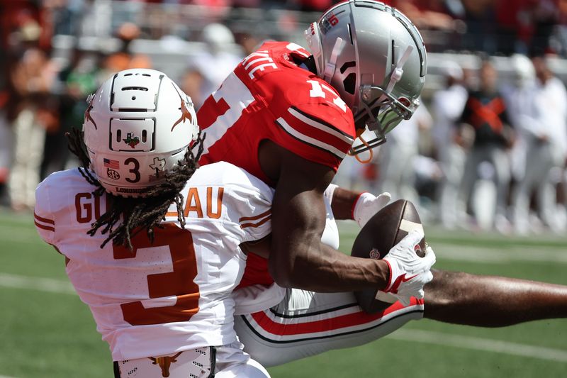 Aug 30, 2025; Columbus, Ohio, USA; Ohio State Buckeyes wide receiver Carnell Tate (17) makes a catch against Texas Longhorns defensive back Jaylon Guilbeau (3) in the first half at Ohio Stadium. Mandatory Credit: Joseph Maiorana-Imagn Images