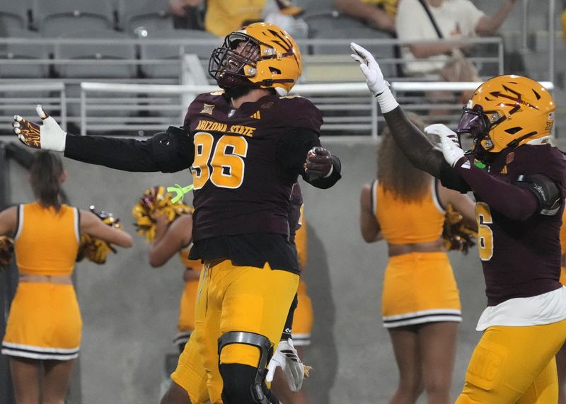 Arizona State Sun Devils defensive lineman Anthonie Cooper (96) celebrates his interception against the Northern Arizona Lumberjacks during a football game at Mountain America Stadium in Tempe on Aug. 30, 2025.