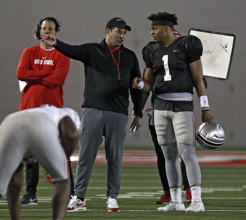 Ohio State Buckeyes quarterback Justin Fields (1) and Ohio State Buckeyes head coach Ryan Day talk during practice at Woody Hayes Athletic Center on March 23, 2019. The Ohio State football program invited current students to attend a student appreciation day practice, the seventh time in the last eight years that a practice has been opened up to honor and thank the students on campus.