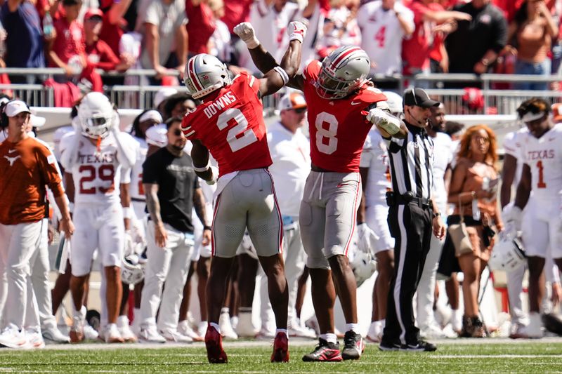 Ohio State Buckeyes safety Caleb Downs (2) and linebacker Arvell Reese (8) celebrate during the NCAA football game against the Texas Longhorns at Ohio Stadium on Aug. 30, 2025.