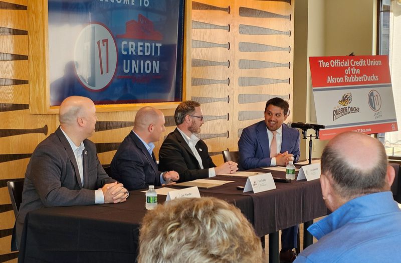 Akron Mayor Shammas Malik, right, smiles Sept. 4 during the announcement of a new name for Akron's Canal Park baseball stadium.