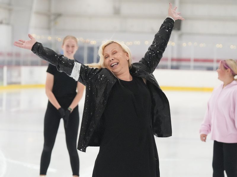 Olympic gold medalist figure skater Oksana Baiul hits a finishing pose after a series of spins while skating at Center Ice in Jackson Township.