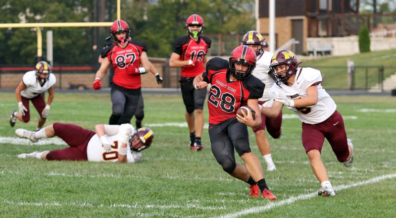 Liberty Union's Ethan Stapleton (28) runs the ball against Meigs.The Liberty Union Lions hosted the Meigs Marauders on Sept. 5, 2025, at Liberty Union High School. The Lions won 56-21.