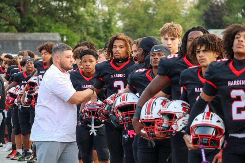 New Marion Harding football coach C.J. Westler greets his team before the national anthem of their home opener against Lima Senior Sept. 5, 2025, in Harding Stadium.
