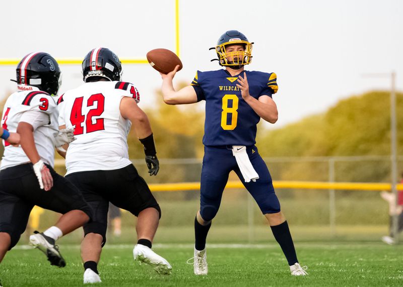 Woodmore's Calvin Lipstraw throws a pass.