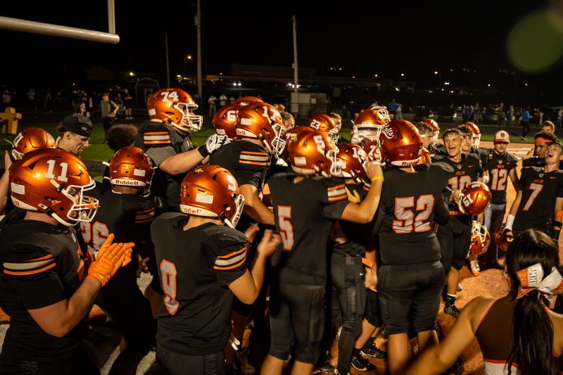 Meadowbrook football players celebrate the win over Cambridge after a football game in Byesville on Friday, September 5th, 2025.