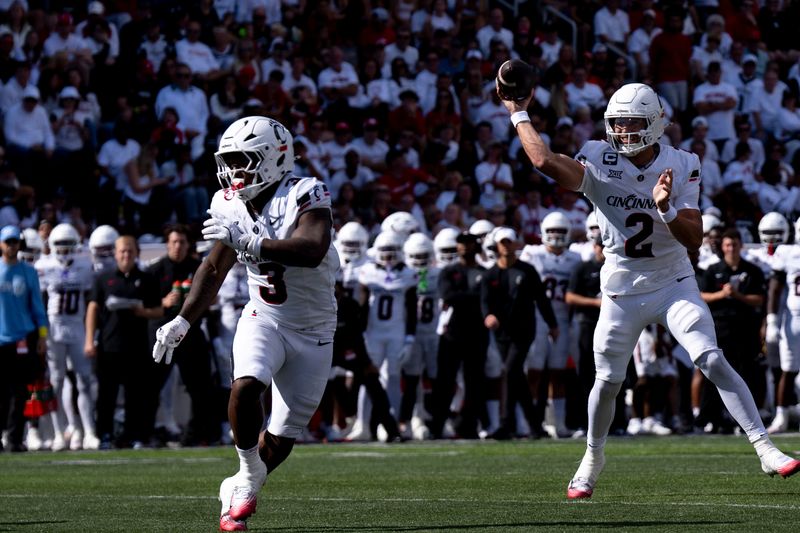 Cincinnati Bearcats quarterback Brendan Sorsby (2) throws a touchdown pass in UC's home opener vs. Bowling Green last Sept. 6. Sorsby left the Bearcats in January for Texas Tech.