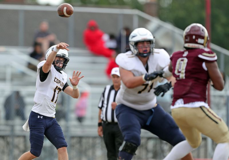 Copley quarterback Dane Wininger (17) attempts a pass during the second half of a high school football game against Garfield, Sept. 6, 2025, in Akron, Ohio.