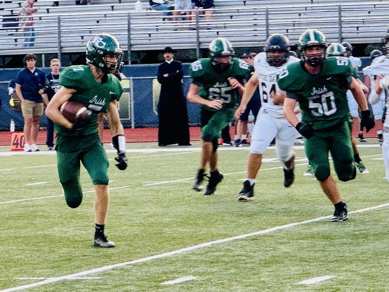 Fisher Catholic senior running back Leo Hampshire looks for running room against Portsmouth Notre Dame during the Irish's 34-6 loss on Saturday, Sept. 6, 2025.