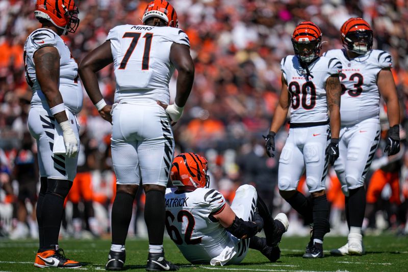 Cincinnati Bengals guard Lucas Patrick (62) goes down injured in the second quarter of the NFL Week 1 game between the Cleveland Browns and the Cincinnati Bengals at Huntington Bank Field in Cleveland on Sunday, Sept. 7, 2025.
