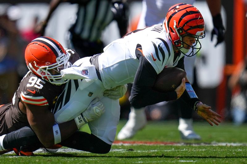 Cincinnati Bengals quarterback Joe Burrow is sacked by Cleveland Browns defensive end Myles Garrett