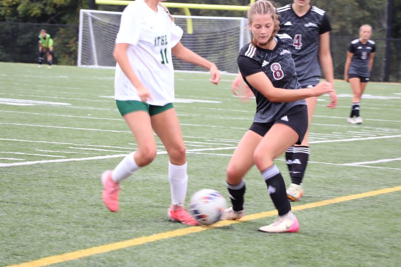 John Glenn's Kendall Snider (8) battles with a Athens player for control of the ball during non-league girls soccer match at John Glenn High School on Saturday, September 6, 2025. The Muskies finished with a 0-0 draw with the Bulldogs.