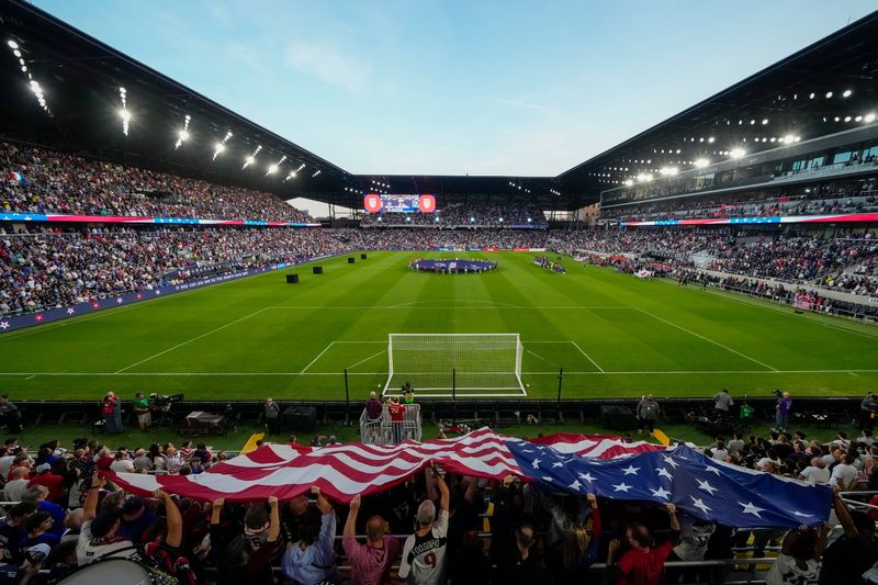 Fans hold an American flag during an international friendly soccer match between the United States Men's National Team and Japan at Lower.com Field in Columbus on Sept. 9, 2025.