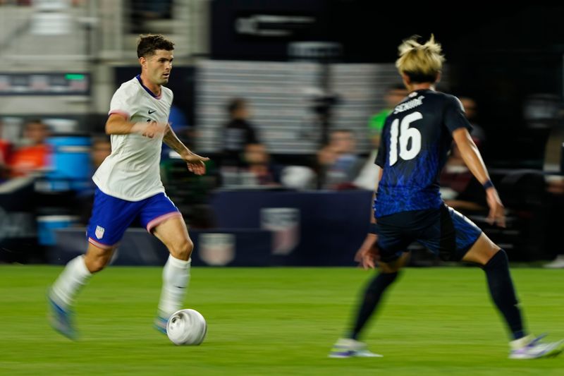 United States forward Christian Pulisic moves the ball against Japan defender Hiroki Sekine during an international friendly in Columbus on Sept. 9, 2025. The U.S. won 2-0.