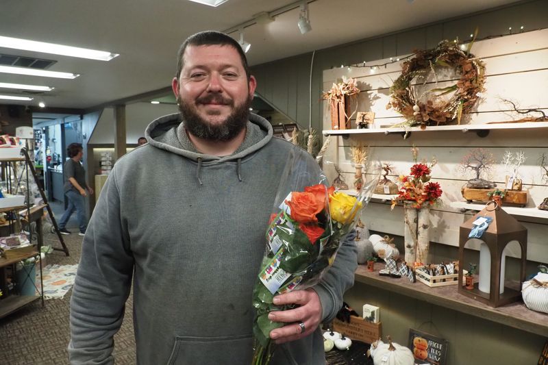 Shaun Sharp planned to give his roses away to neighbors. He said a good neighbor is someone who helps those around them.