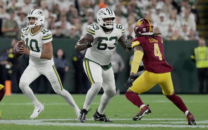 Green Bay Packers offensive tackle Rasheed Walker (63) provides pass protection for quarterback Jordan Love (10) during the first quarter of their game against the Washington Commanders Thursday, September 11, 2025 at Lambeau Field in Green Bay, Wisconsin.