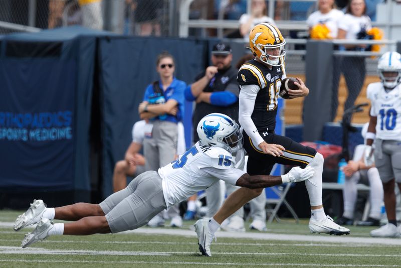 Kent State quarterback Dru DeShields tries to shake Buffalo linebacker SaVeon Brown during a game Sept. 13, 2025, at Dix Stadium in Kent, Ohio.