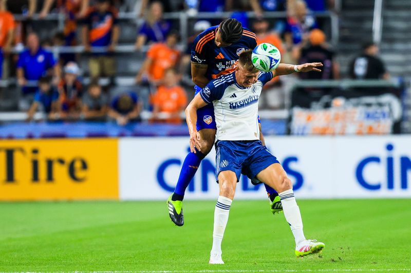 FC Cincinnati defender Mile Robinson, left, contests a header against Nashville SC forward Sam Surridge in the first half at TQL Stadium Sept. 13. FCC clinched a playoff berth with its 2-1 victory.