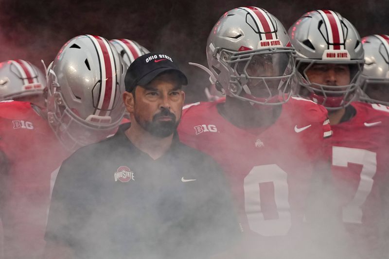 Ohio State Buckeyes head coach Ryan Day leads his team onto the field prior to the NCAA football game against the Ohio Bobcats at Ohio Stadium on Sept. 13, 2025.