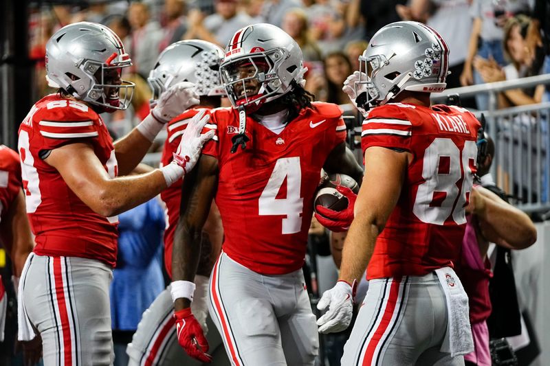 Ohio State Buckeyes wide receiver Jeremiah Smith (4) celebrates a touchdown during the NCAA football game against the Ohio Bobcats at Ohio Stadium on Sept. 13, 2025. Ohio State won 37-9.