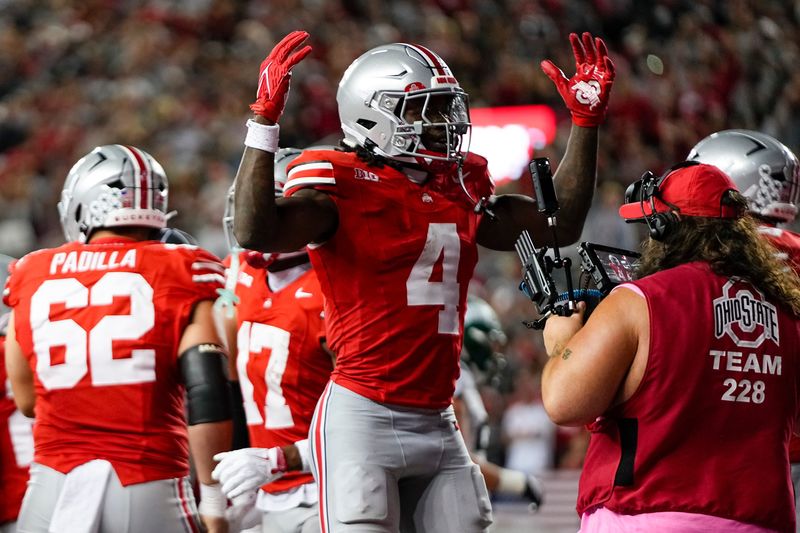 Ohio State Buckeyes wide receiver Jeremiah Smith (4) celebrates a touchdown during the NCAA football game against the Ohio Bobcats at Ohio Stadium on Sept. 13, 2025. Ohio State won 37-9.