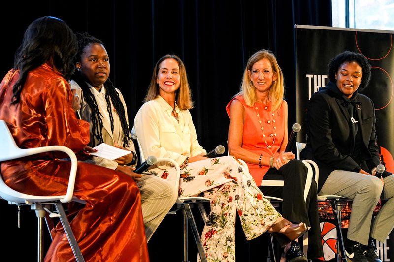A panel discussion for students on women’s basketball during a Cleveland WNBA event, Sept. 16, 2025, features (from left) Cavaliers in-arena host Kierra Cotton, WNBA VP of Ticket Sales and Service Kiersten Green, Cleveland WNBA President of Business Operations Allison Howard, WNBA Commissioner Cathy Engelbert and WNBA Director of Youth Basketball Operations Jessica Davis.