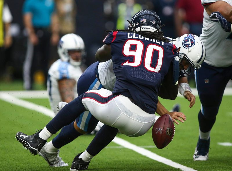 Jadeveon Clowney makes a strip-sack for the Texans against Titans quarterback Matt Cassel in the fourth quarter of a 2017 game.