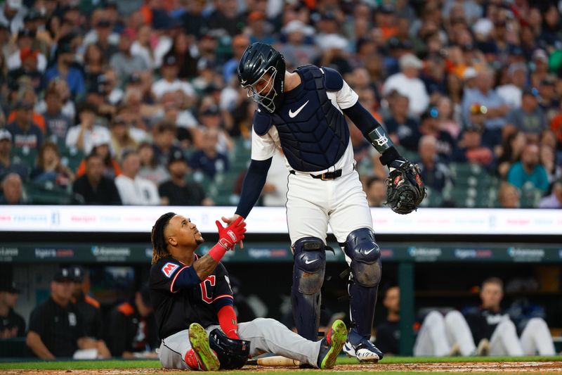 Detroit Tigers catcher Dillon Dingler helps Cleveland Guardians' Jose Ramirez to his feet during an at-bat on Sept. 17, 2025, in Detroit, Michigan.