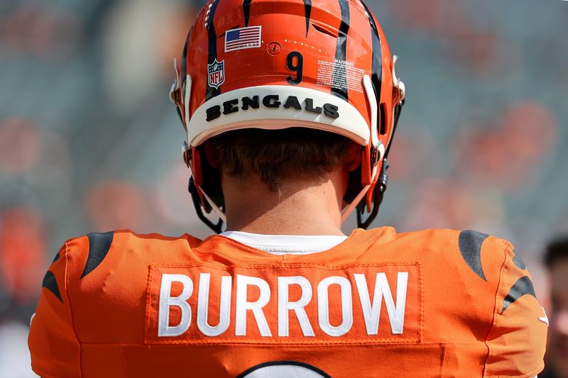 Sep 14, 2025; Cincinnati, Ohio, USA; Cincinnati Bengals quarterback Joe Burrow (9) warms up before the game against the Jacksonville Jaguars at Paycor Stadium. Mandatory Credit: Joseph Maiorana-Imagn Images